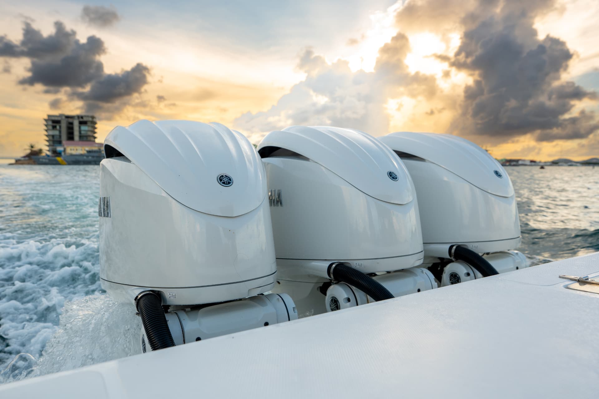 Triple Yamaha outboards at sunset