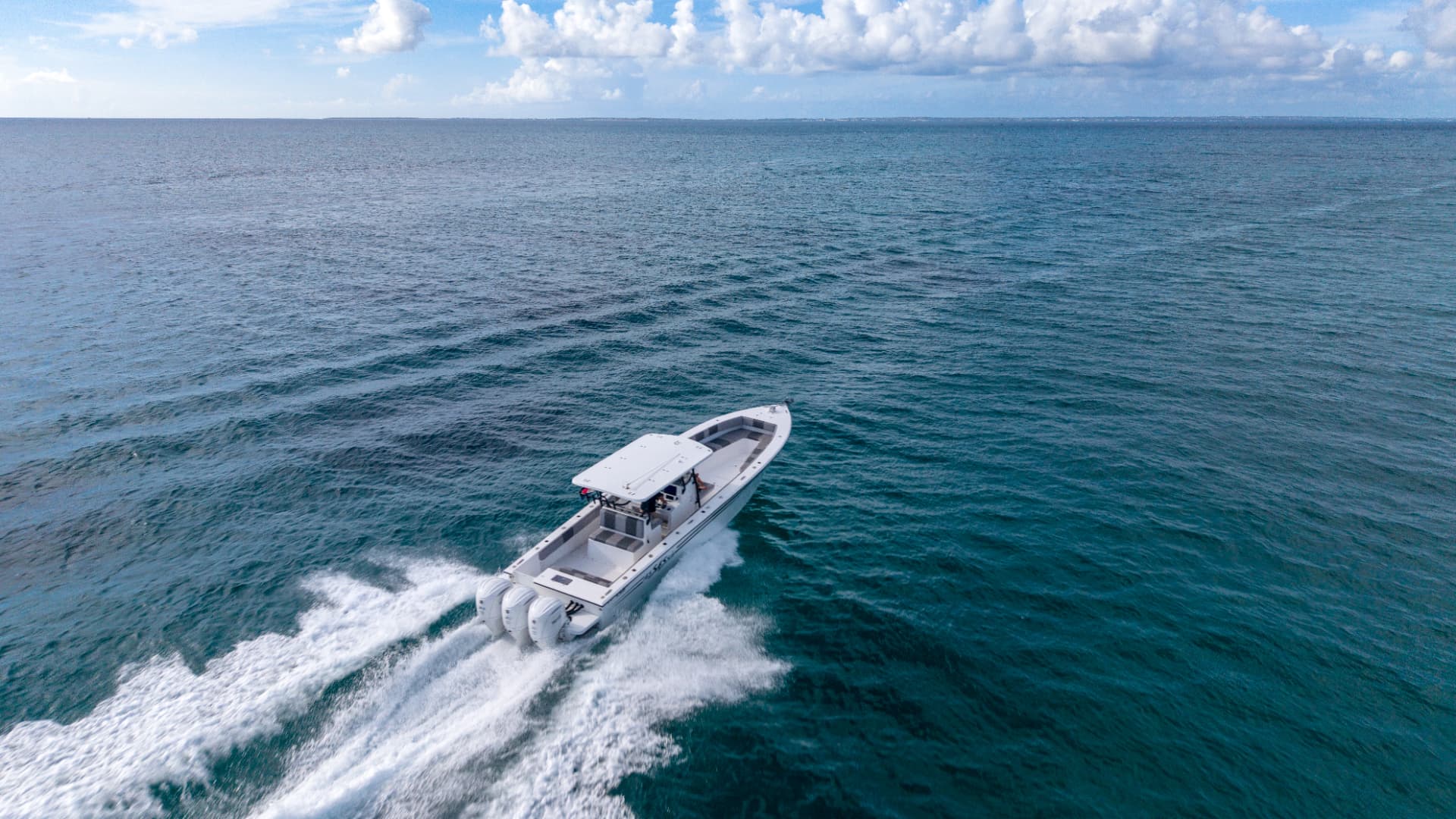 APEX Charters 43 ft KSB center-console running across open Caribbean water